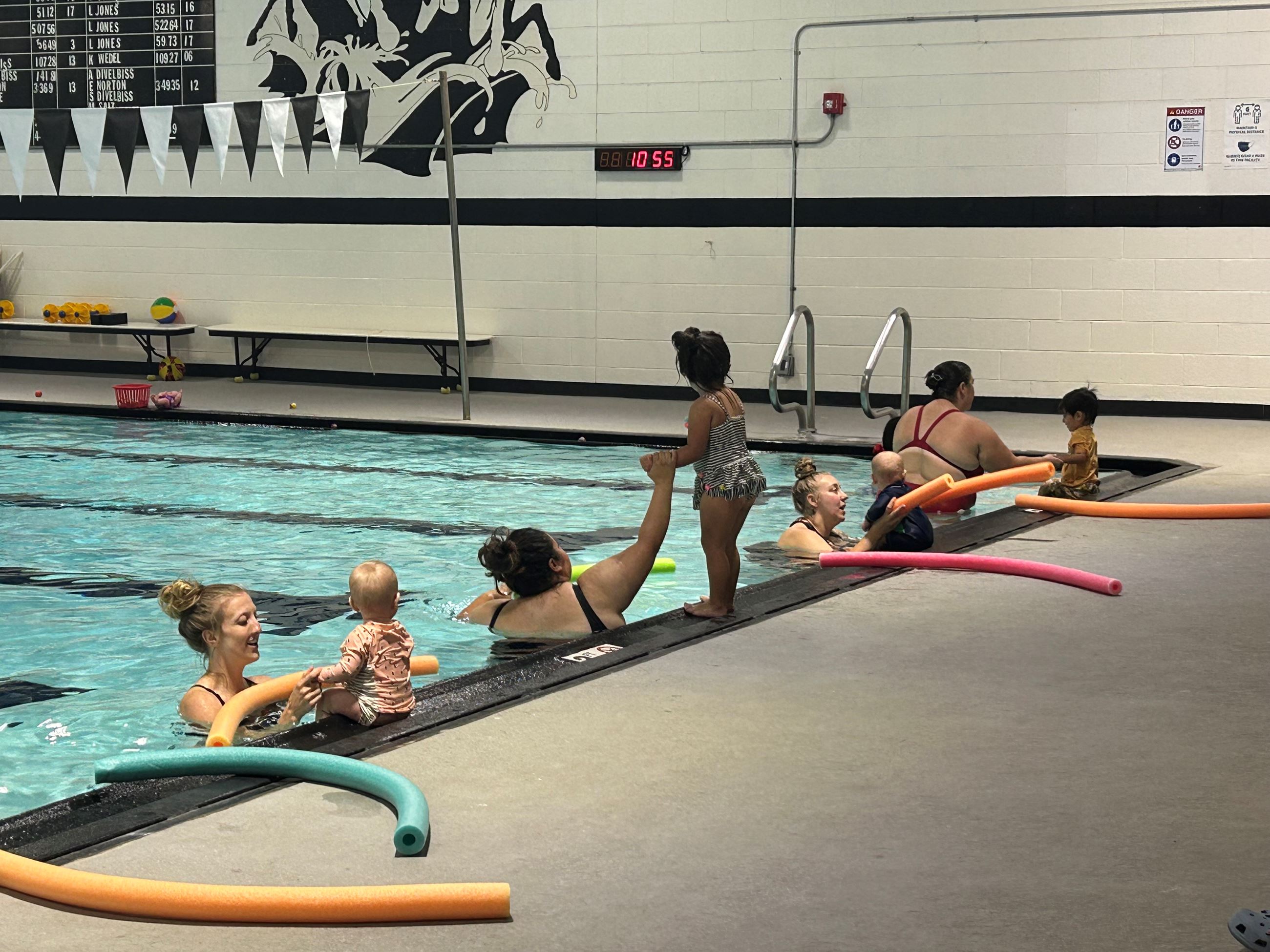 Picture of participants in the Parent and Tot Swimming Lessons at South High School Pool. 
